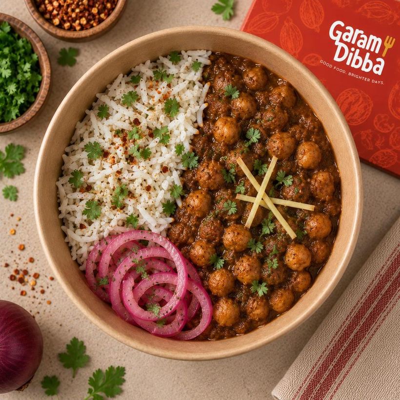 Garam Dibba Pindi Chole bowl with rice and pickled onion